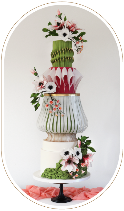 Colourful artistic 4 tier wedding cake. Sugar hand made magnolias. Wafer paper textures and forms.