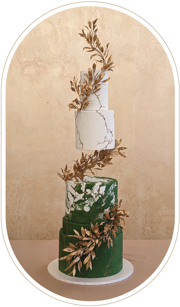 Textured green and white 4 tier wedding cake, with floating tiers separator, hand made wafer paper gold italian ruscus. Gold cracks