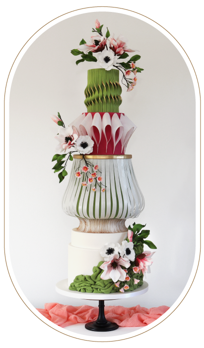 Colourful artistic 4 tier wedding cake. Sugar hand made magnolias. Wafer paper textures and forms.